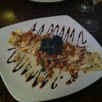 Graze - Duck Confit Ravioli- sage brown butter, sundried apricots, toasted macadamia nuts and topped with crunchy kale! - New American Near Me - Mount Pleasant, South Carolina