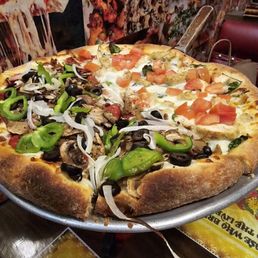 Half & Half Raffallo's Special and BBQ Chicken Pizza. Half & Half Raffallo's Special and BBQ Chicken Pizza.