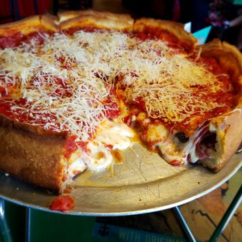 Oregano's - Stuffed Chicago pizza with salami, cappicola, portobello, caramelized onion and sundried tomatoes. - Pizza Near Me - Tucson, Arizona
