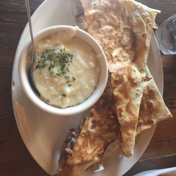 Toast - Bacon, Onion, and Cheese Crepes with a side of grits - Breakfast & Brunch Near Me - New Orleans, Louisiana Toast - Bacon, Onion, and Cheese Crepes with a side of grits - Breakfast & Brunch Near Me - New Orleans, Louisiana