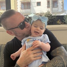Happy baby and happy dad eating good foods Happy baby and happy dad eating good foods