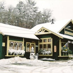 a green building with yellow trim