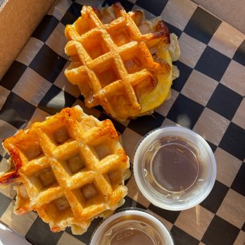 The Smashed Waffle Company - Chicken Waffle Sandwich aka The Stinger and Egg and Cheese Waffle Sandwich aka All Cracked Up with their special syrup - Waffles Near Me - Pittsburgh, Pennsylvania The Smashed Waffle Company - Chicken Waffle Sandwich aka The Stinger and Egg and Cheese Waffle Sandwich aka All Cracked Up with their special syrup - Waffles Near Me - Pittsburgh, Pennsylvania