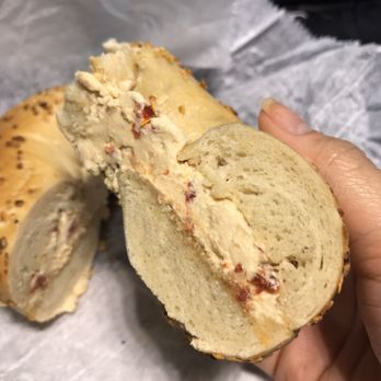 Bakin Bagels - Onion bagel with sun dried tomato spread - Bagels Near Me - Maywood, New Jersey