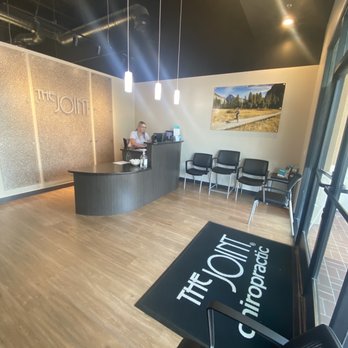 The Joint Chiropractic - The lobby, sign in desk and Holly! :) - Chiropractors Near Me - Fresno, California The Joint Chiropractic - The lobby, sign in desk and Holly! :) - Chiropractors Near Me - Fresno, California