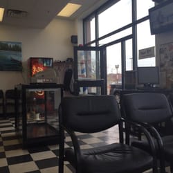Barber Mug Barber Shop - Waiting area and front desk/door area