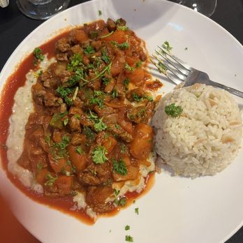 Ephesus Mediterranean Grill - I forget the name, lamb in tomato sauce over eggplant. - Mediterranean Near Me - Dallas, Texas Ephesus Mediterranean Grill - I forget the name, lamb in tomato sauce over eggplant. - Mediterranean Near Me - Dallas, Texas