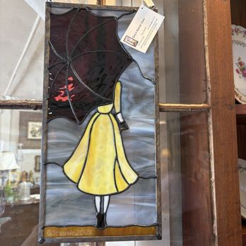 SuzAnna's Antiques - Stained glass display piece of woman with umbrella - Antiques Near Me - Rolesville, North Carolina