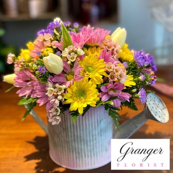 Granger Florist - Springtime arrangement in a decorative watering can. - Florists Near Me - Granger, Indiana