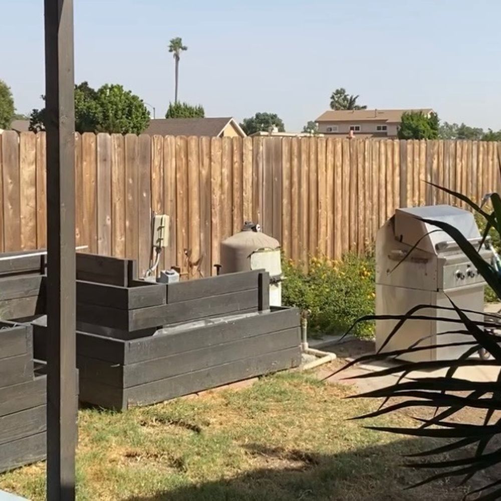 Infinity Design and Build - Where the fire table is and pool equipment before remodel - General Contractors Near Me - San Diego, California Infinity Design and Build - Where the fire table is and pool equipment before remodel - General Contractors Near Me - San Diego, California