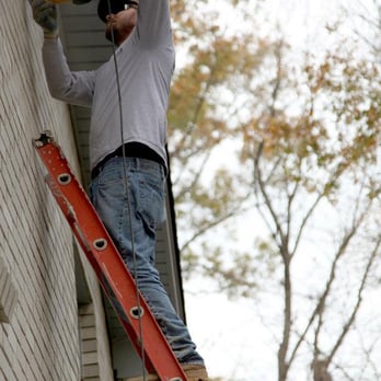United Structural Systems - Josh Elkins, crew leader, grinds the old mortar between some bricks to open it up to place helical brick ties into studs. - Waterproofing Near Me - Pleasant View, Tennessee United Structural Systems - Josh Elkins, crew leader, grinds the old mortar between some bricks to open it up to place helical brick ties into studs. - Waterproofing Near Me - Pleasant View, Tennessee