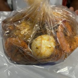 Shrimp - head on with hot n juicy medium sauce with egg, sausage and potato