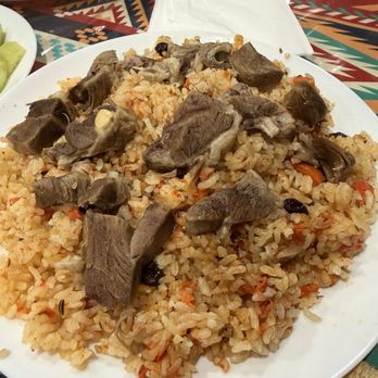 Turan Uyghur Kitchen - E3. Lamb Shank Polow E3. - Halal Near Me - Houston, Texas