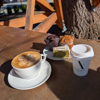 Aroma Coffee - Bee in a Tree latte, kids steamer, matcha almond cake, raspberry white chocolate muffin, and double chocolate muffin - Coffee & Tea Near Me - Fall City, Washington Aroma Coffee - Bee in a Tree latte, kids steamer, matcha almond cake, raspberry white chocolate muffin, and double chocolate muffin - Coffee & Tea Near Me - Fall City, Washington