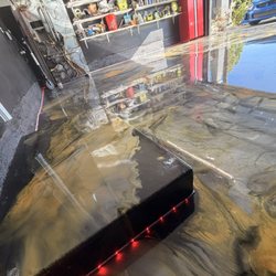 Starlux Spaces - Premium metallic epoxy swirl design for a unique, high-end look. No two floors are the same.