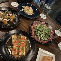 Augustine - Duck crepes, caprese salad, beef carpaccio, blue crab spaghetti