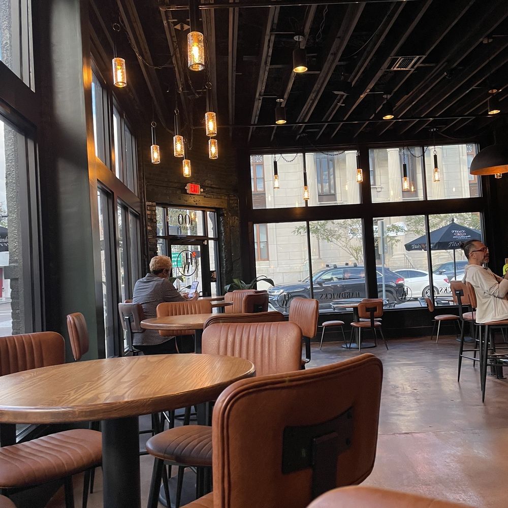 a restaurant with tables and chairs a restaurant with tables and chairs