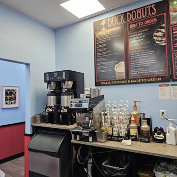 Duck Donuts - The coffee machine and menu posted on the wall. - Donuts Near Me - Roanoke, Virginia Duck Donuts - The coffee machine and menu posted on the wall. - Donuts Near Me - Roanoke, Virginia