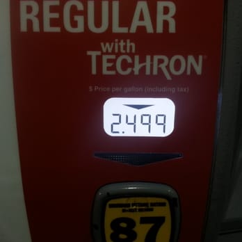 Chevron - a gas pump with a clock on it - Gas Stations Near Me - Irvine, California