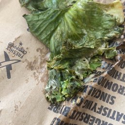 a piece of lettuce on a paper bag