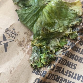 Carl's Jr - a piece of lettuce on a paper bag - Fast Food Near Me - Lomita, California
