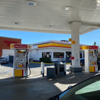 Shell - gas pumps at a gas station with mountains in the background - Gas Stations Near Me - Palm Desert, California Shell - gas pumps at a gas station with mountains in the background - Gas Stations Near Me - Palm Desert, California