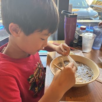 Lotus Restaurant - Older son enjoying his meatball pho! - Vietnamese Near Me - Minneapolis, Minnesota Lotus Restaurant - Older son enjoying his meatball pho! - Vietnamese Near Me - Minneapolis, Minnesota