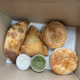 Empanada, samosa, and beef pastries. Empanada, samosa, and beef pastries.