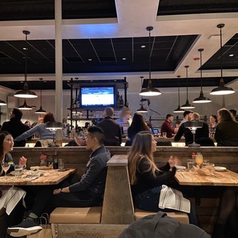 Bar 'Cino - Interior is a mix of tables, booths, high tops and the bar. - Italian Near Me - Brookline, Massachusetts