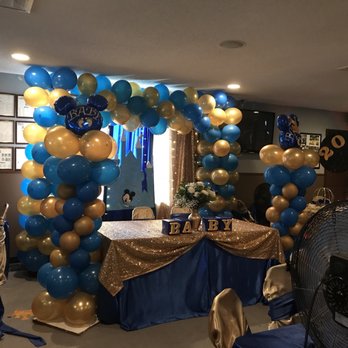 The Clubhouse - a man standing in front of a table with balloons and a fan - Lounges Near Me - San Antonio, Texas The Clubhouse - a man standing in front of a table with balloons and a fan - Lounges Near Me - San Antonio, Texas