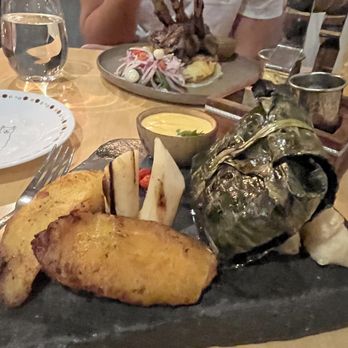 Llama Restaurant - Grouper wrapped in plantain leaves, with yuca, palm of hearts, and the amazing passion fruit sauce! - Peruvian Near Me - Saint Augustine, Florida