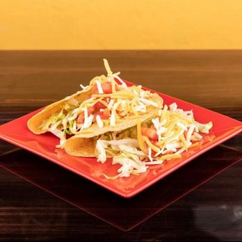 Don Patron - a plate of tacos on a table - Mexican Near Me - Bristol, Rhode Island