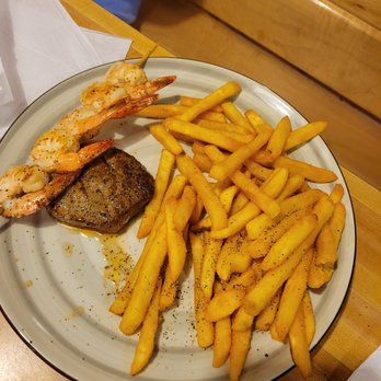 Snapperz Grill & Steam Bar - Surf and turn, 4 oz filet, grilled shrimp and over abundance of fries. - Seafood Near Me - Morehead City, North Carolina Snapperz Grill & Steam Bar - Surf and turn, 4 oz filet, grilled shrimp and over abundance of fries. - Seafood Near Me - Morehead City, North Carolina