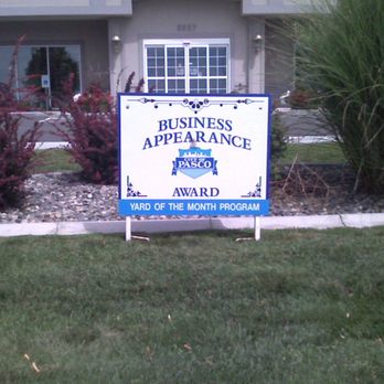 IVE Landscaping - a business appearance sign in front of a house - Landscaping Near Me