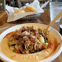 Chicken Shawarma Bowl with Spicy Hummus, tabbouleh, and village salad. Chicken Shawarma Bowl with Spicy Hummus, tabbouleh, and village salad.
