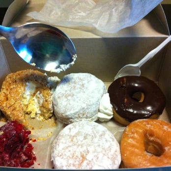 Paula's Donuts - Comparisons in size of a plastic spoon vs. a metal cooking spoon. - Donuts Near Me - Tonawanda, New York