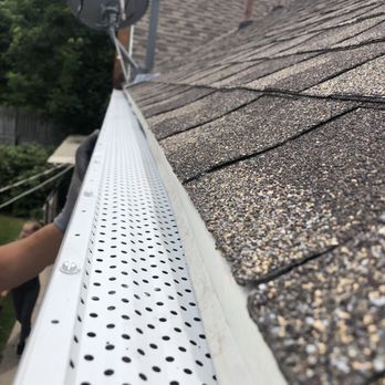 CKD Rain Gutters - a man fixing a gutter - Gutter Services Near Me CKD Rain Gutters - a man fixing a gutter - Gutter Services Near Me