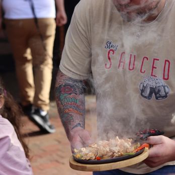 Sauced - a man holding a plate of food - Pizza Near Me - Waynesville, North Carolina Sauced - a man holding a plate of food - Pizza Near Me - Waynesville, North Carolina