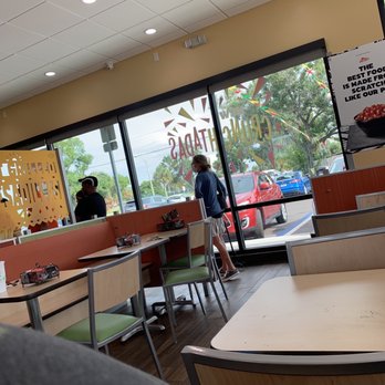 Del Taco - a man sitting at a table in a restaurant - Tacos Near Me - Melbourne, Florida