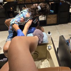 Elite Nail Spa - Getting a pedicure but the employee is more interested in watching the world cup.