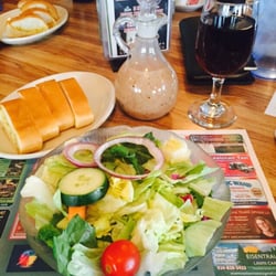 Salad with Italian Dressing, Garlic Bread, and a glass of Lambrusco