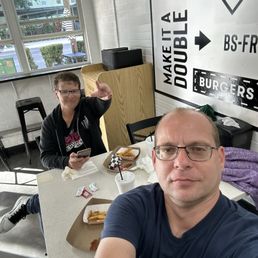 Hanging out with a friend. Enjoying great burgers and fries. Hanging out with a friend. Enjoying great burgers and fries.