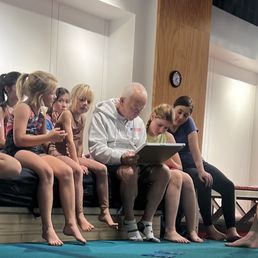 Coaches working with the kids to understand forms as part of the practice. Coaches working with the kids to understand forms as part of the practice.