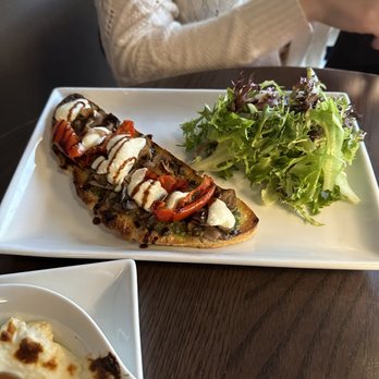 Salut Wine and Cocktail Lounge - Roasted tomato & goat cheese Tartine - Cocktail Bars Near Me - Topeka, Kansas Salut Wine and Cocktail Lounge - Roasted tomato & goat cheese Tartine - Cocktail Bars Near Me - Topeka, Kansas