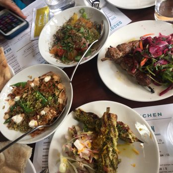 Arabica Bar & Kitchen - Clockwise from top: heirloom tomato salad, lamb kebab, chicken shish, and summer vegetable freeke - Arabic Near Me - London, XGL Arabica Bar & Kitchen - Clockwise from top: heirloom tomato salad, lamb kebab, chicken shish, and summer vegetable freeke - Arabic Near Me - London, XGL