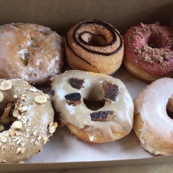 Vortex Doughnuts - Vegan fritter, cinnamon with French broad chocolate, raspberry, stout, maple bacon and vanilla glaze - Coffee & Tea Near Me - Asheville, North Carolina Vortex Doughnuts - Vegan fritter, cinnamon with French broad chocolate, raspberry, stout, maple bacon and vanilla glaze - Coffee & Tea Near Me - Asheville, North Carolina
