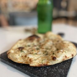 Karma Modern Indian - The warmest, crispiest fresh garlic cilantro Naan