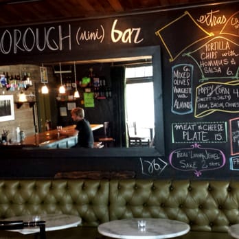 Elliotborough Mini Bar - The inside menu wall w the musician in far left corner- very quaint place ! Great for a date :) - Wine Bars Near Me - Charleston, South Carolina Elliotborough Mini Bar - The inside menu wall w the musician in far left corner- very quaint place ! Great for a date :) - Wine Bars Near Me - Charleston, South Carolina
