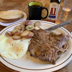 Victoria's Deli & Restaurant - T-Bone steak   2  eggs over easy, parsley, buttered, potatoes, rye, toast, and coffee