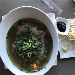 a bowl of soup with meat and vegetables a bowl of soup with meat and vegetables